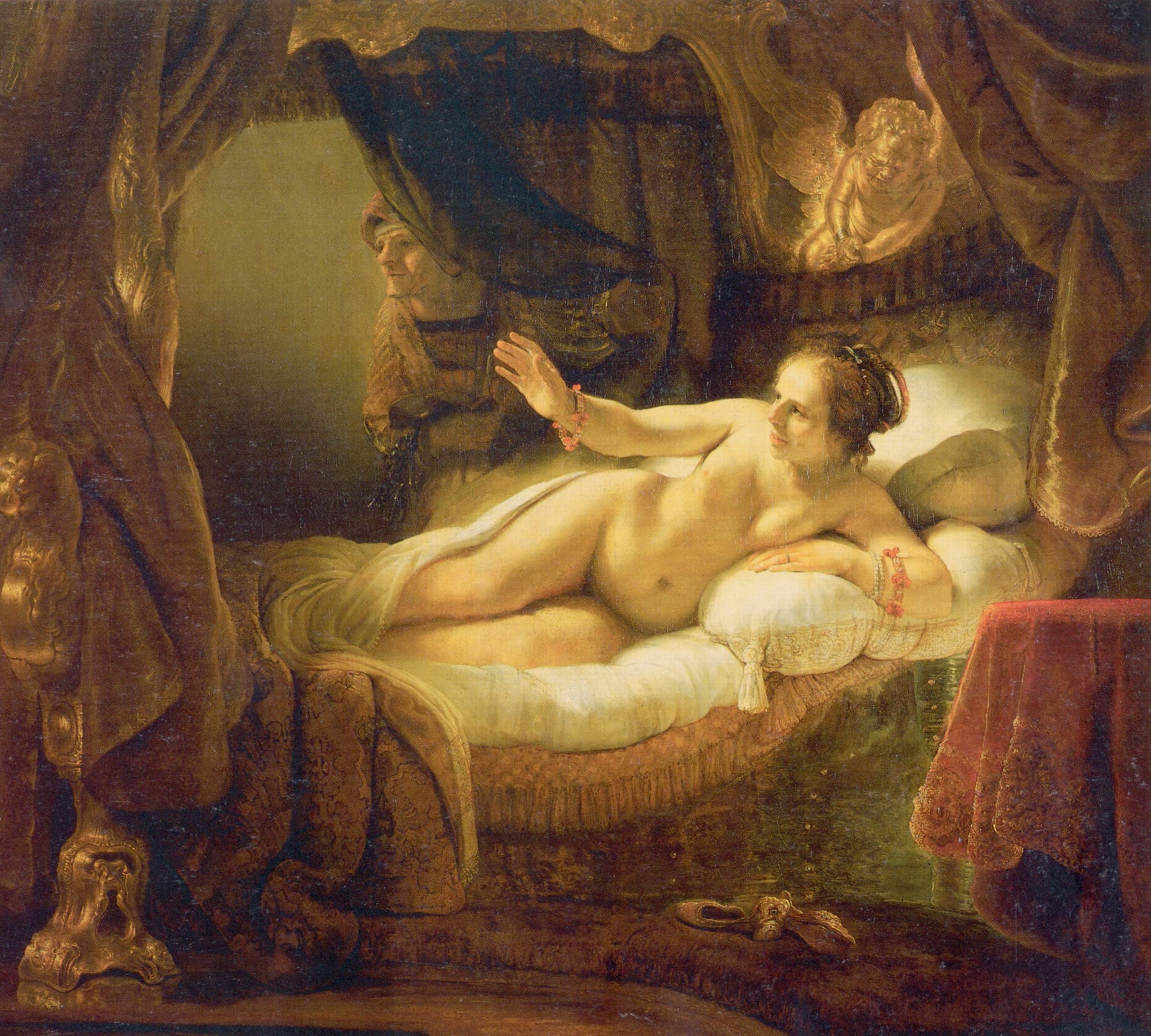 A life-sized nude woman reclines on a bed, body turned toward a fall of light, one arm extended, in a dimly lit interior on a wide canvas.