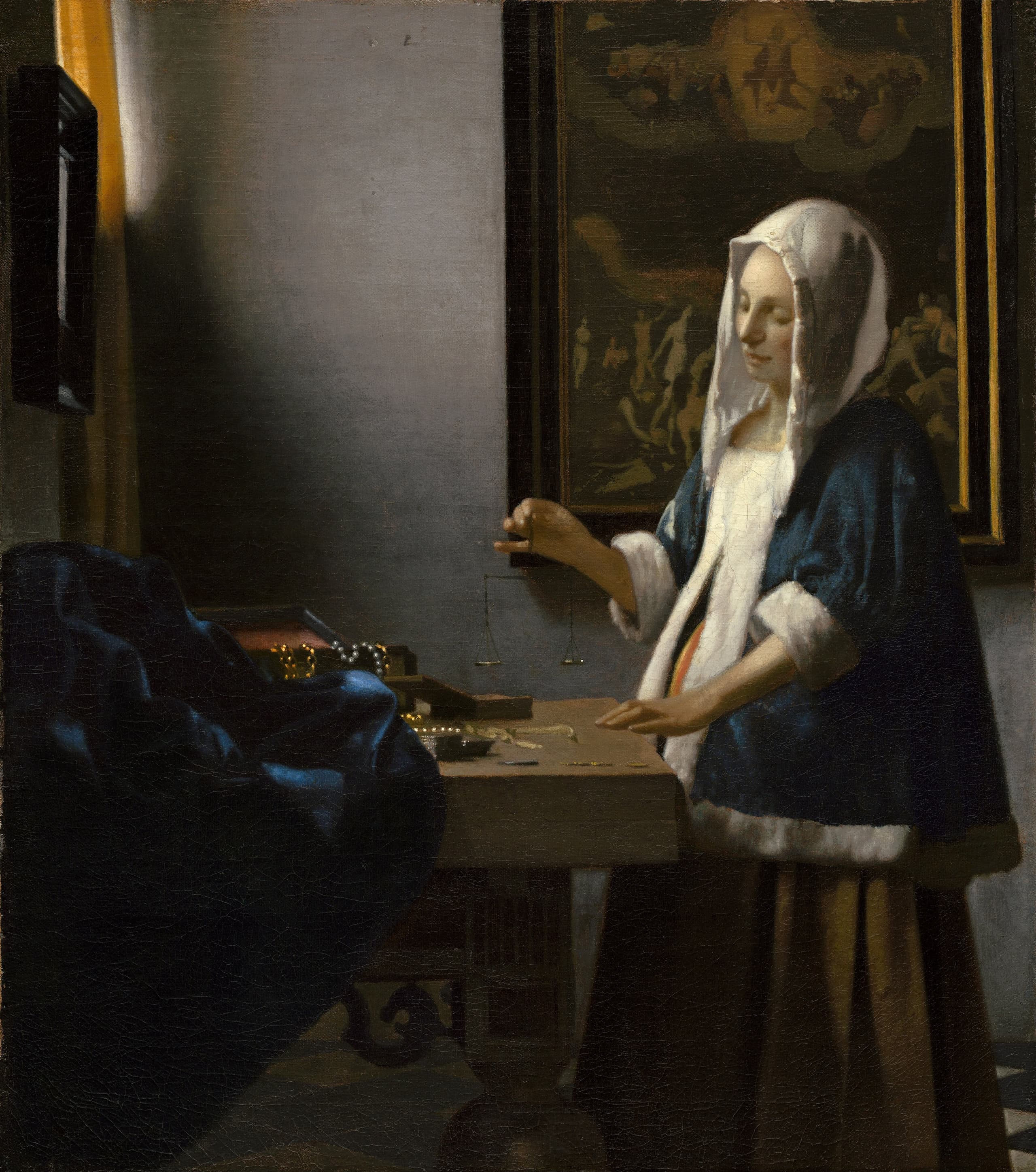 A quiet interior with a woman standing at a table, holding a small balance level in one hand; the pans appear empty. The canvas is modest in scale and lit with restrained clarity.